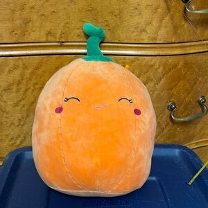 EUC 8” PAIGE THE PUMPKIN ORANGE WITH GREEN CURLY TOP “STEM” SQUISHMALLOW